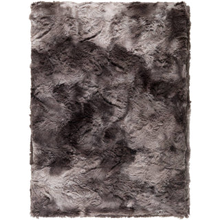 Soft and luxurious Felina Throw in neutral tones, perfect for cozy evenings