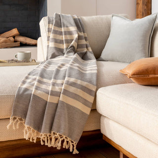 Hand-woven tassel throw blanket in a cozy, neutral color palette